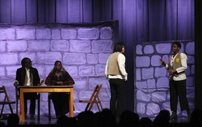 Lord Ó Catháin played by Favour Agbesua (L), Lady Ó Catháin played by Elianna Johnson (2ndFL), Reginald Ó Catháin played by Em Roach (2ndFR), Domhnall Ó Catháin played by Favor Dugbor (R), during St. Pius X's Cappies production of To Have The Confidence of a Man, on March 12th, 2026