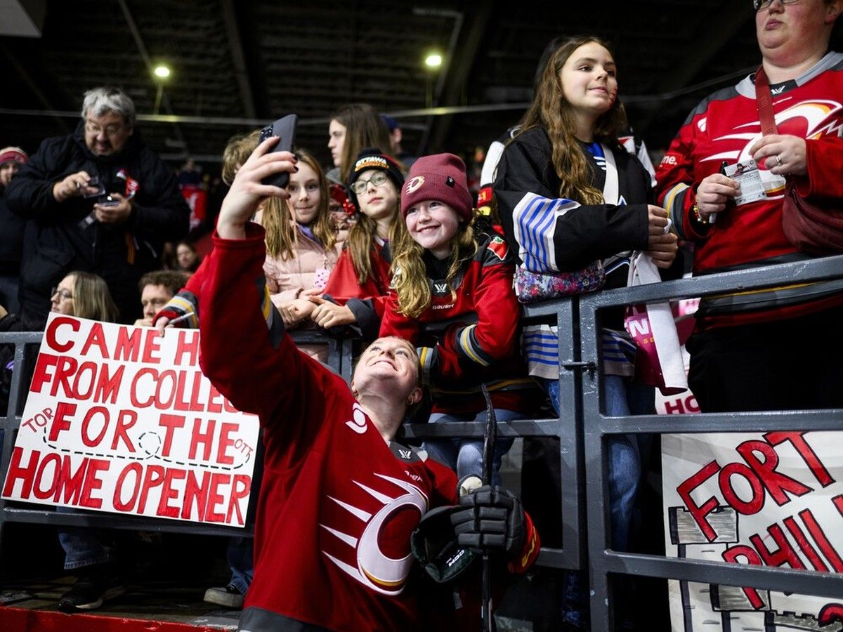 Alexa Vasko takes a selfie with a young fan.