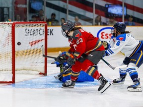 Ottawa Charge forward Sarah Wozniewicz puts the puck in the net