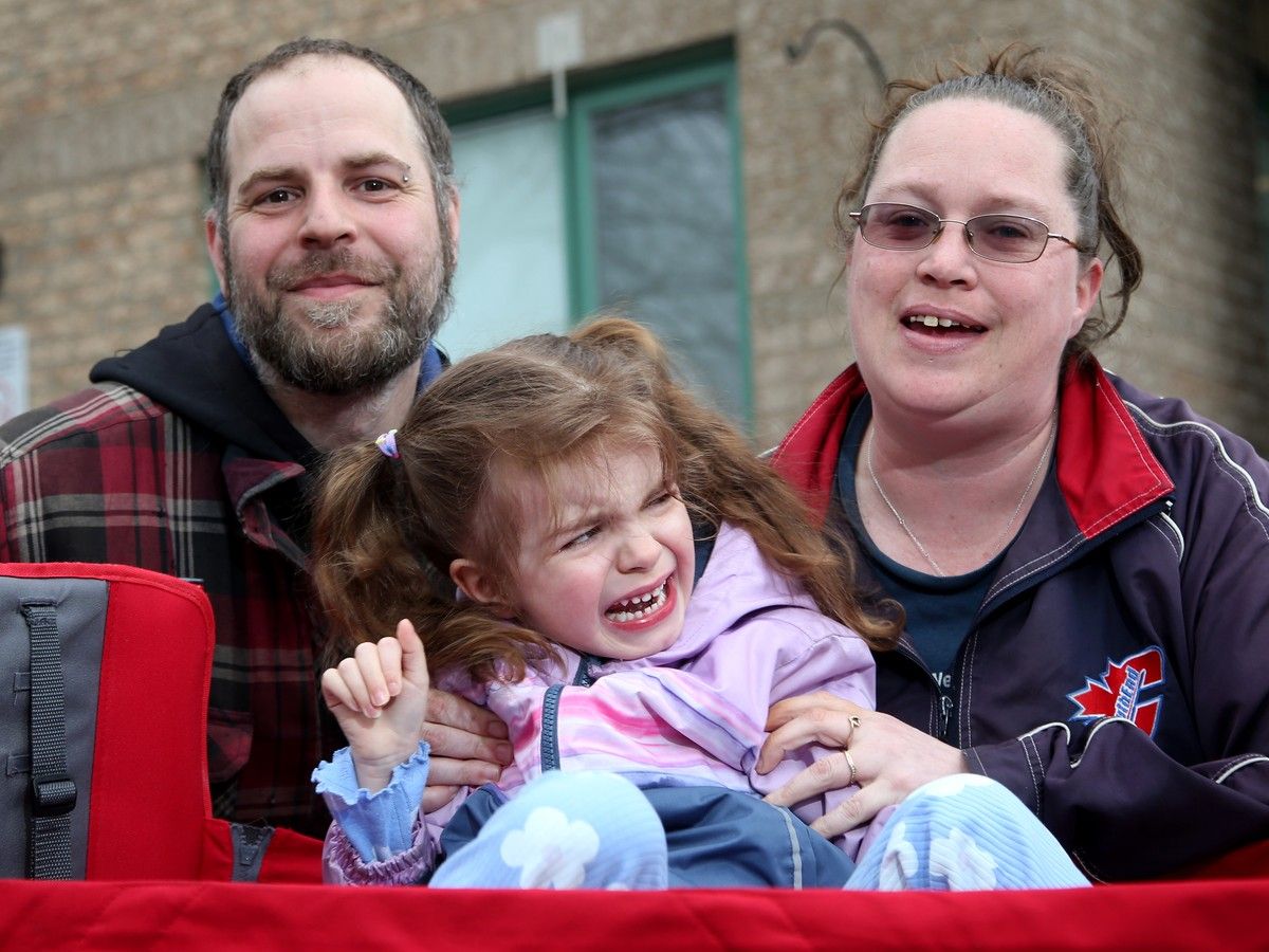 Jennifer and Andrew try to get one picture with their daughter, Arizona, 4, where she isn't screamingor thrashing about. She has autism and doesn't like strangers or cameras, so getting her picture taken is an ordeal. One can see how exhausting it is for the parents. Recently, the last full-time education assistant in Arizona's classroom left and caused all the walls to fall for the family, forcing Jennifer to leave her job and landing them now in a shelter.