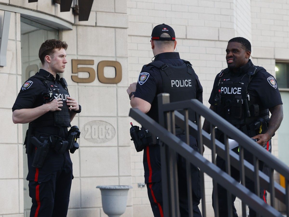 Ottawa police and paramedics were at the scene of 50 Laurier Ave. E on Monday evening. Police had the rear west side of the building taped off.