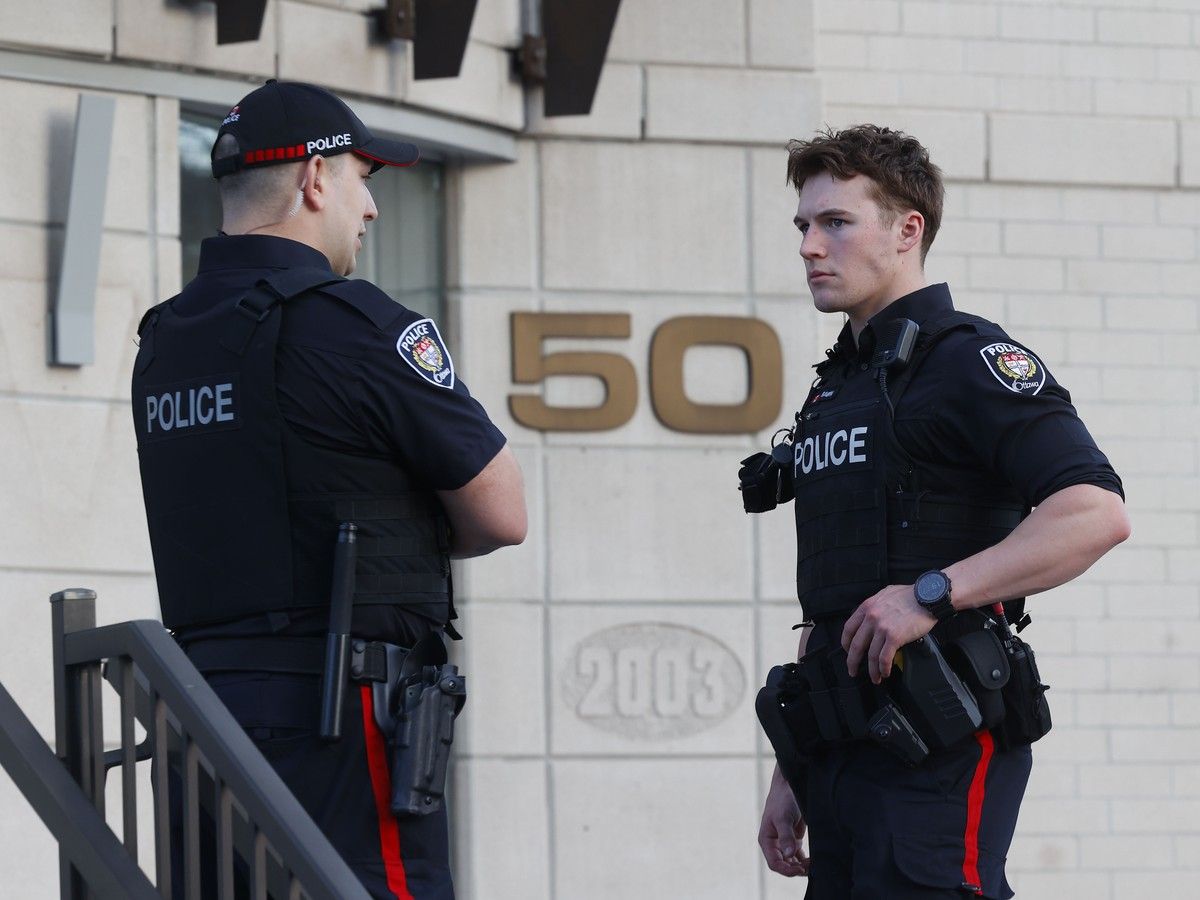  Ottawa police and paramedics were at the scene of 50 Laurier Ave. E on Monday evening. Police had the rear west side of the building taped off.