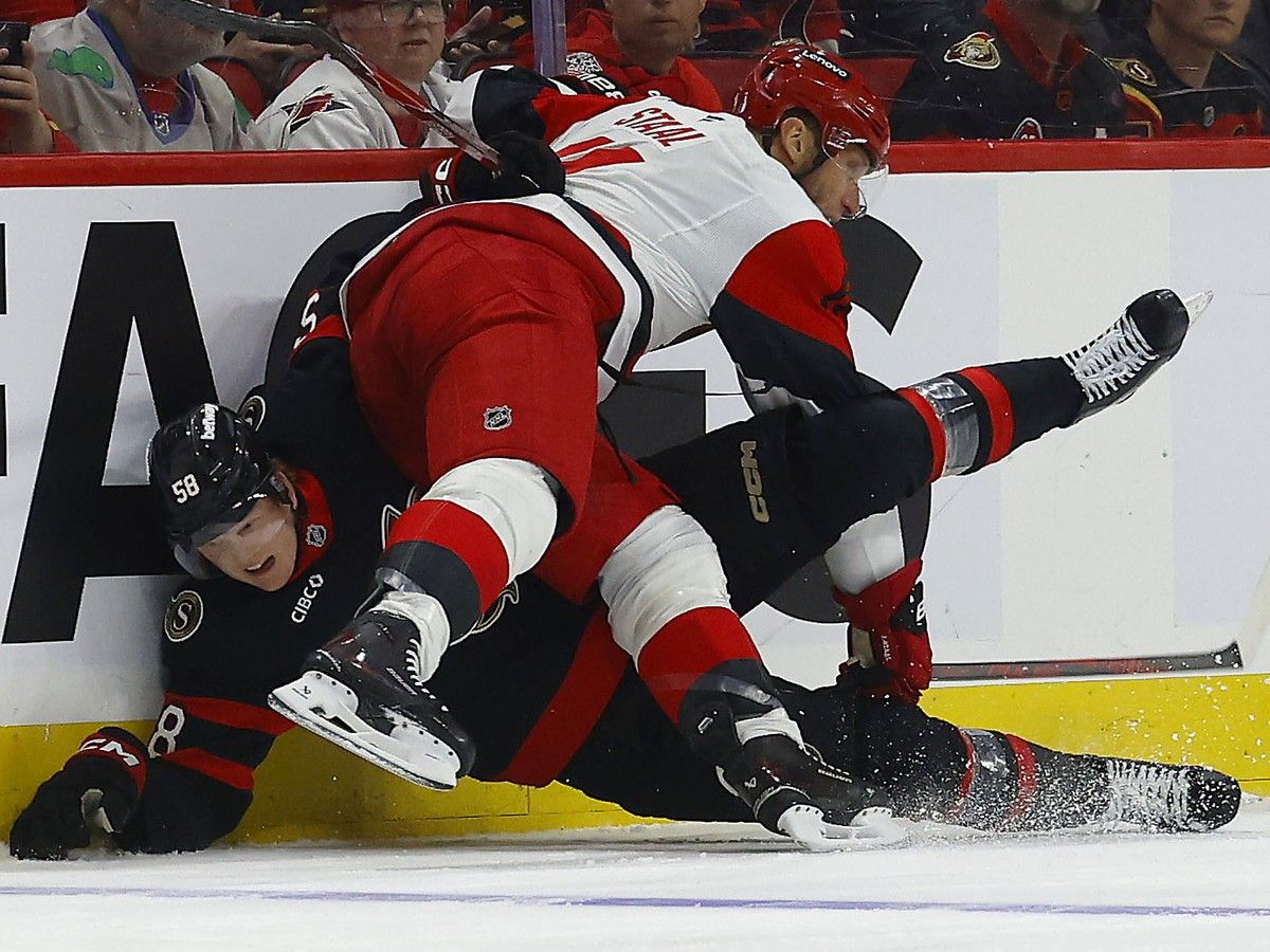 Ottawa Senator Carter Yakemchuk gets hit by Jordan Staal