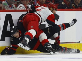 Ottawa Senator Carter Yakemchuk gets hit by Jordan Staal
