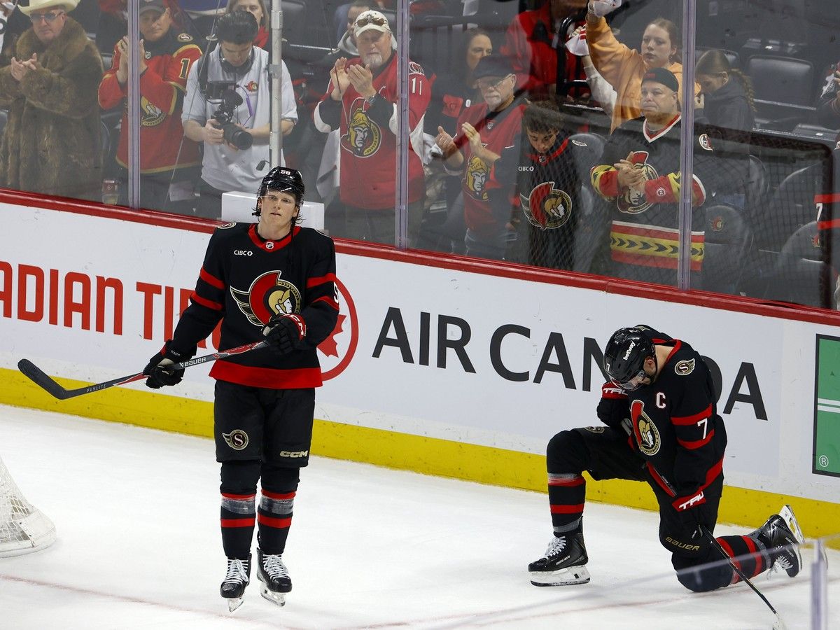 Dejected Ottawa Senators Carter Yakemchuk and Brady Tkachuk