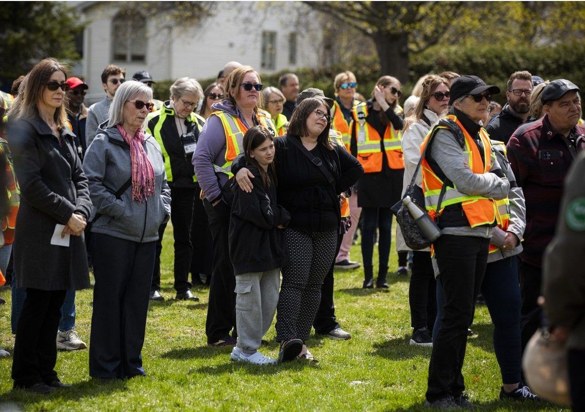 Community members gathered for an emotional vigil for Barrhaven crossing guard Peter Clark