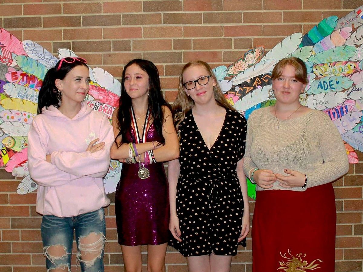 From left, Katherine, Nikita, Harley and Mackayla Elliott pose for Nikita's Grade 8 graduation two years ago, in this photo provided by the family.