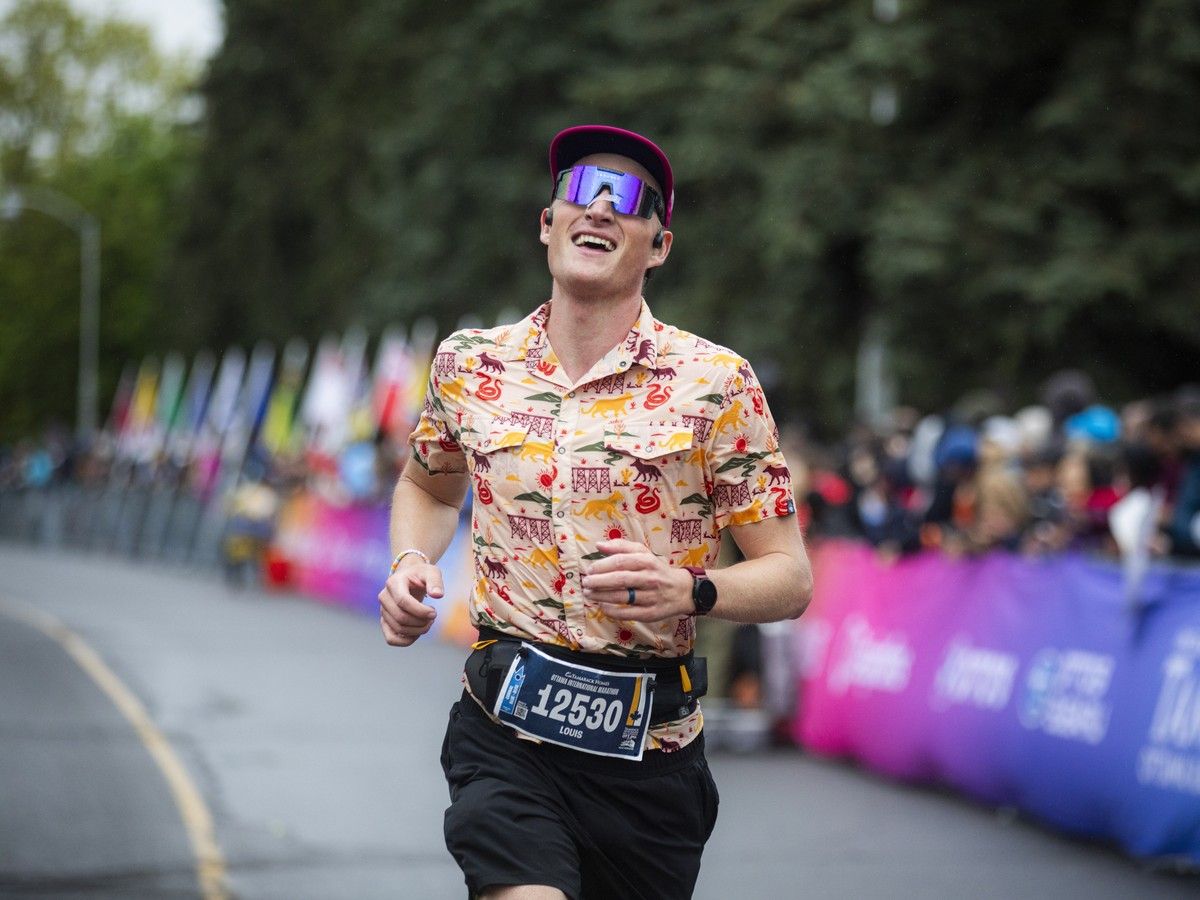  Louis Johnson of Calgary crossing the marathon finish line.