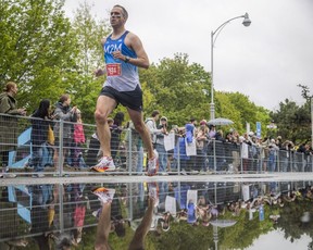 Warren Layton running to the finish line of his half marathon Sunday morning.