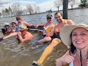 Christiane Aitken (right) went plunging in Britannia flood water with other local ice dippers on Apr. 21, 2026.