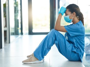 Stock photo tired stressed nurse