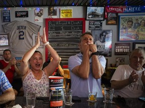Canadian supporters, including Deborah and Paul Theriault, gathered at Pubblico Eatery to cheer on Canada's men's national soccer team during its FIFA World Cup match against South Africa, Sunday, June 28, 2026.