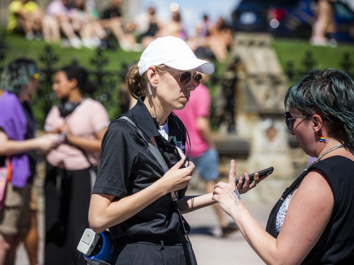  A file photo shows Capital Pride executive director Callie Metler speaking with a representative of Queers for Palestine Ottawa after the group&rsquo;s protest brought the 2025 parade to a halt.