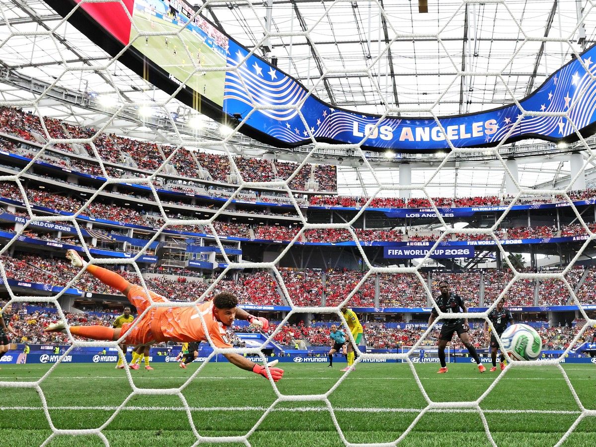 Ronwen Williams #1 of South Africa fails to save a shot from Stephen Eustaquio #7 of Canada (obscured) as he scores his team's first goal during the FIFA World Cup 2026 Round Of 32 match between South Africa and Canada at Los Angeles Stadium.