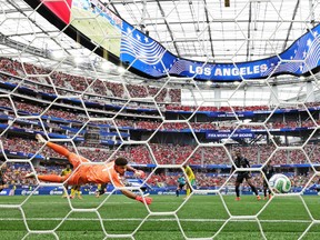 Ronwen Williams #1 of South Africa fails to save a shot from Stephen Eustaquio #7 of Canada (obscured) as he scores his team's first goal during the FIFA World Cup 2026 Round Of 32 match between South Africa and Canada at Los Angeles Stadium.