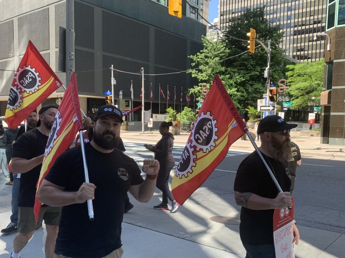 Alex Silas, national executive vice-president of the Public Service Alliance of Canada, stands on a picket line of security officers at the Bank of Canada. The bargaining unit is his home local. Alex Silas, national executive vice-president of the Public Service Alliance of Canada, stands on a picket line of security officers at the Bank of Canada. The bargaining unit is his home local.