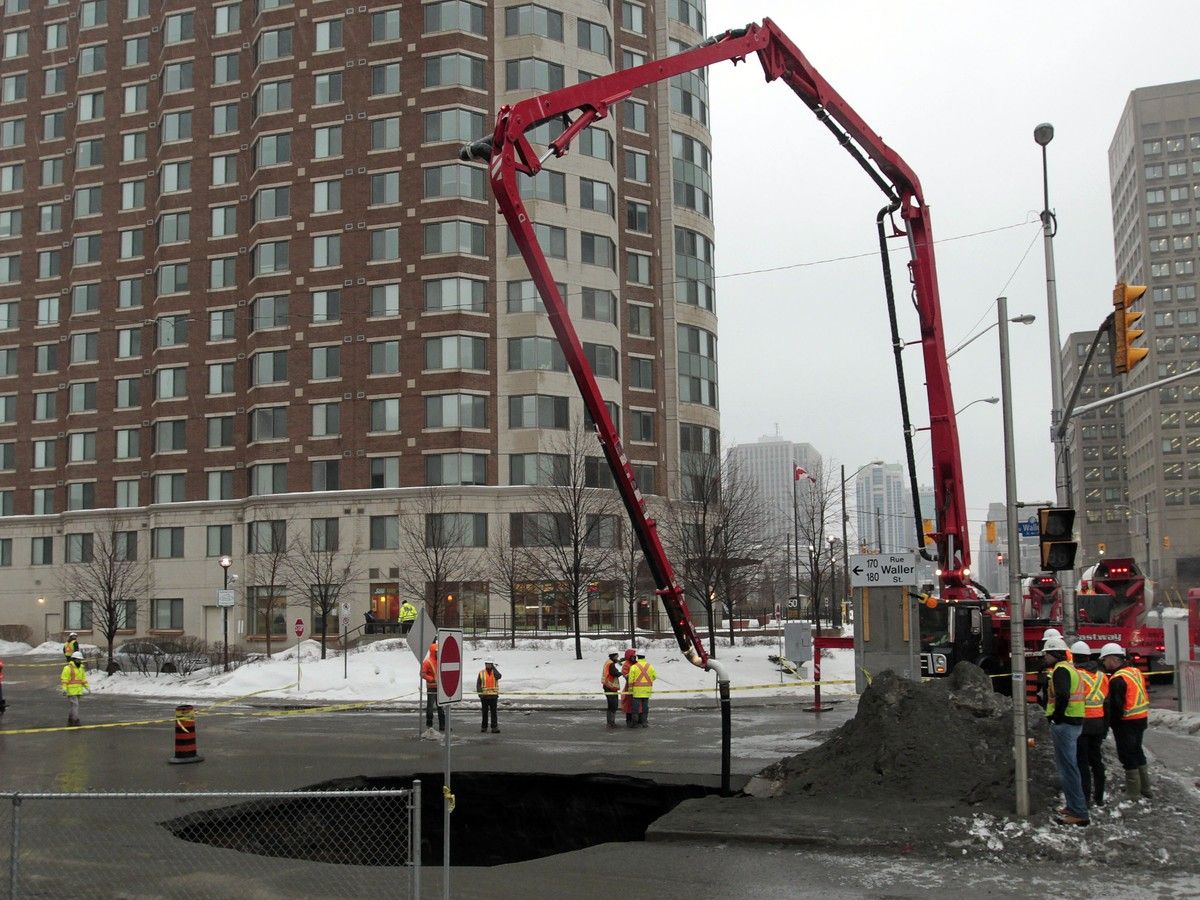 Ottawa crews work on a sinkhole in Waller Street in Ottawa on Feb 21, 2014. Ottawa crews work on a sinkhole in Waller Street in Ottawa on Feb 21, 2014.