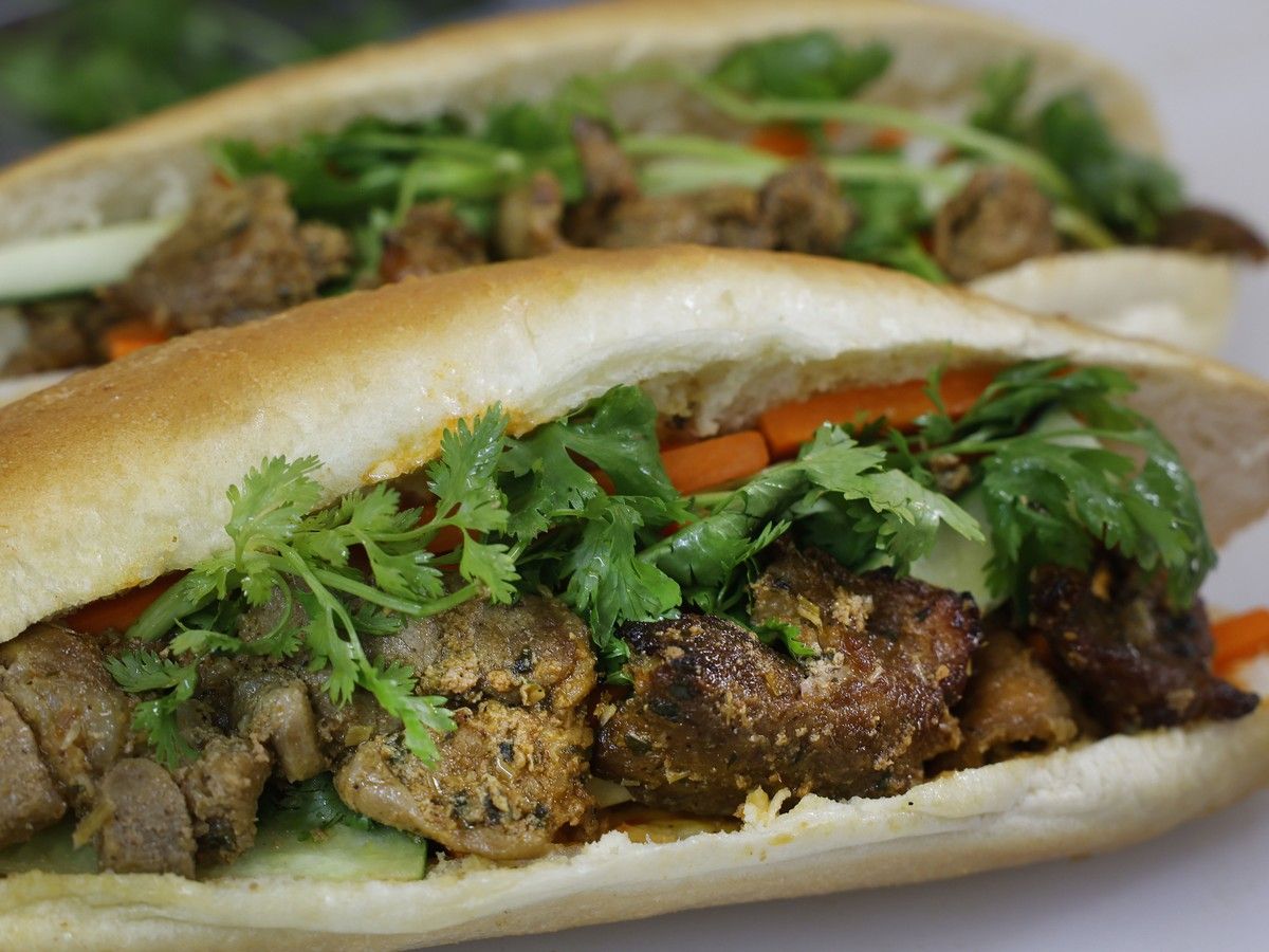 A banh mi sandwich with grilled pork.