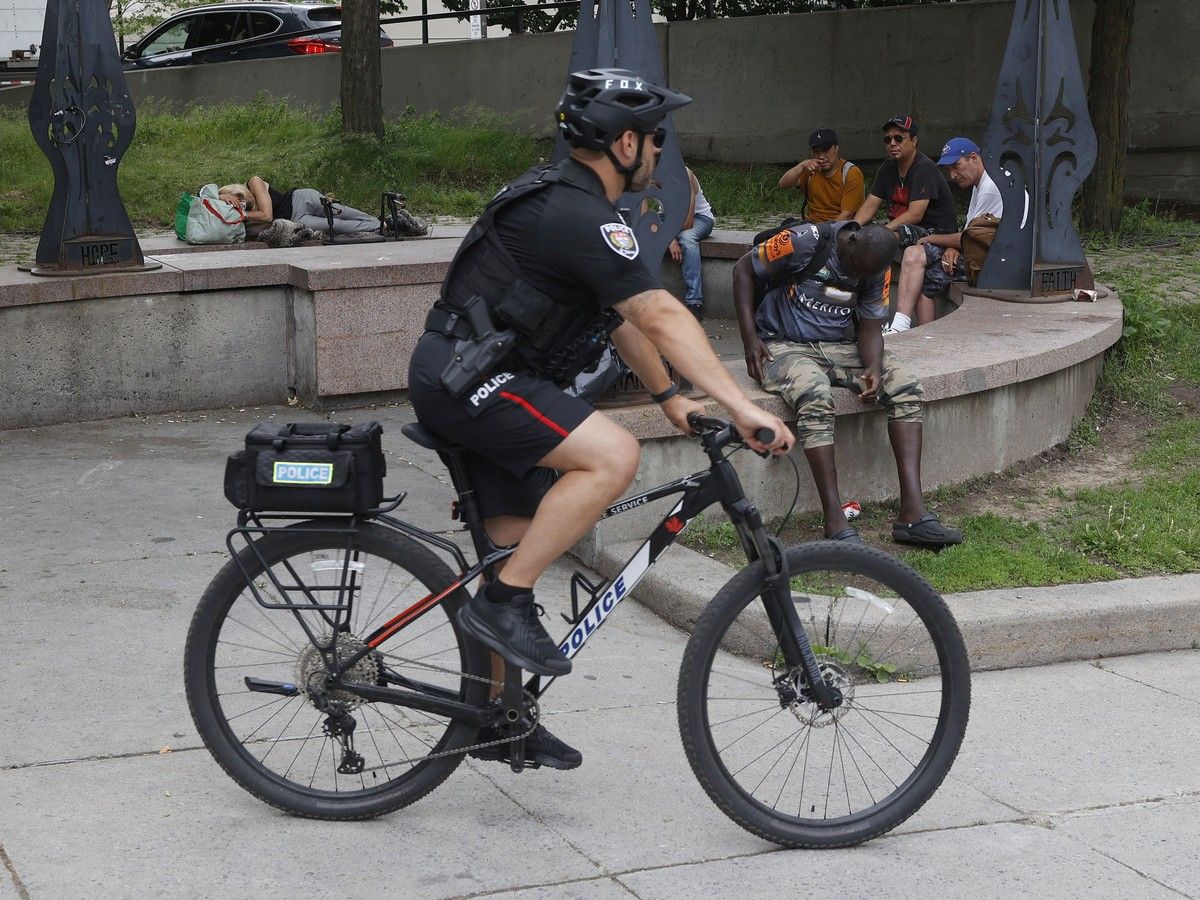 An Ottawa police officer rides his bike near the Circle