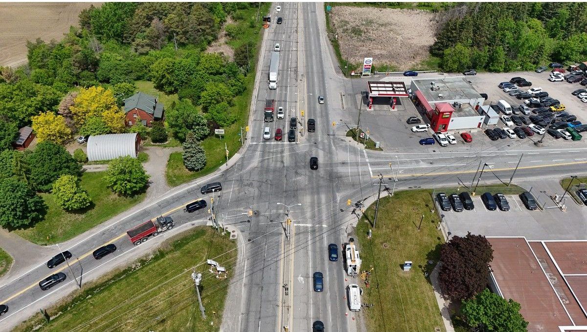  Bank Street and Leitrim Road, looking north toward downtown Ottawa. City engineers are now doing design work to modify the intersection but they still need to acquire land from the NCC, part of which can be seen at the top left, before any construction can begin.