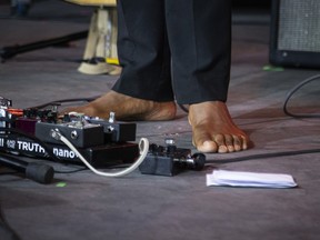 Hawaii-born singer-songwriter and guitarist Ron Artis II performs barefoot during Ottawa Bluesfest at LeBreton Flats on Saturday, July 11, 2026.