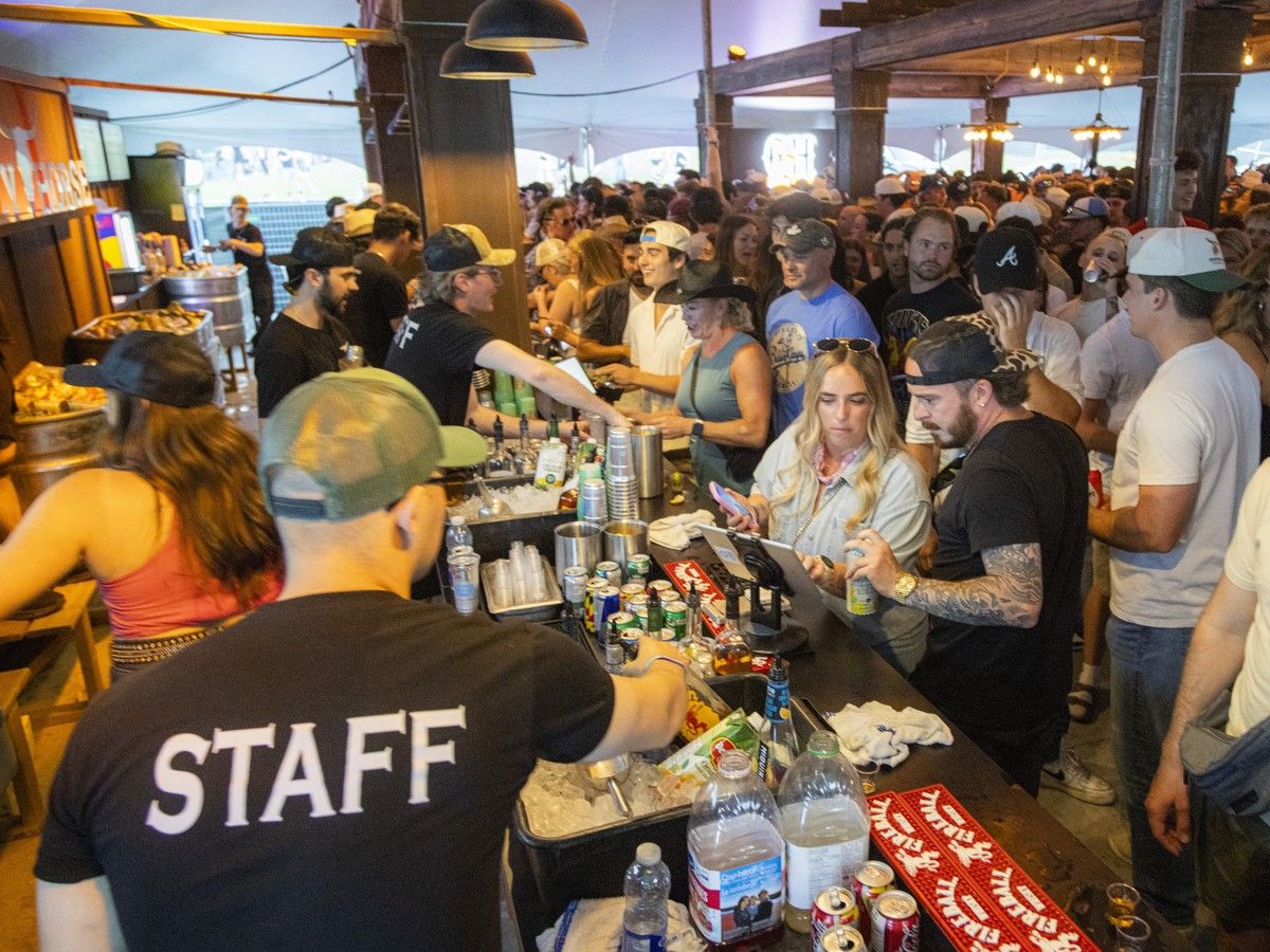 The bar inside the Crazy Horse tent stayed busy as festivalgoers enjoyed another evening at Ottawa Bluesfest at LeBreton Flats, Saturday, July 11, 2026. The bar inside the Crazy Horse tent stayed busy as festivalgoers enjoyed another evening at Ottawa Bluesfest at LeBreton Flats, Saturday, July 11, 2026.