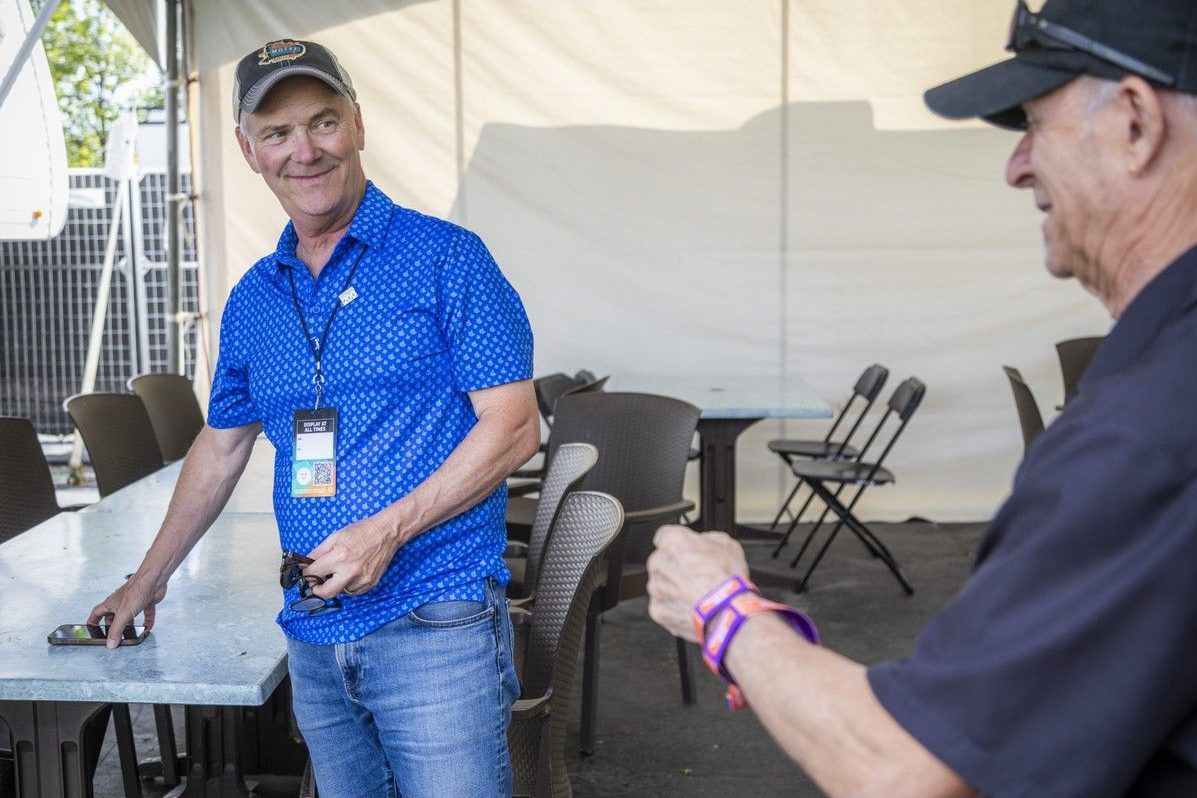Ottawa Bluesfest CEO and co-founder Mark Monahan confers with communications director AJ Sauve at LeBreton Flats Park on July 19. Ottawa Bluesfest CEO and co-founder Mark Monahan confers with communications director AJ Sauve at LeBreton Flats Park on July 19.