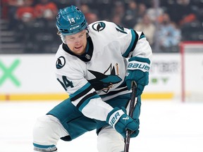 Jackson LaCombe of the Anaheim Ducks blocks a shot by Kasper Halttunen of the San Jose Sharks during a pre-season game in 2025.