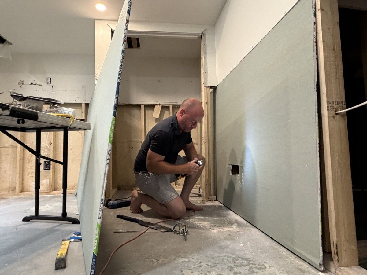 Andre Bard works in his basement to repair damage from the intense Canada Day flooding. Andre Bard works in his basement to repair damage from the intense Canada Day flooding.