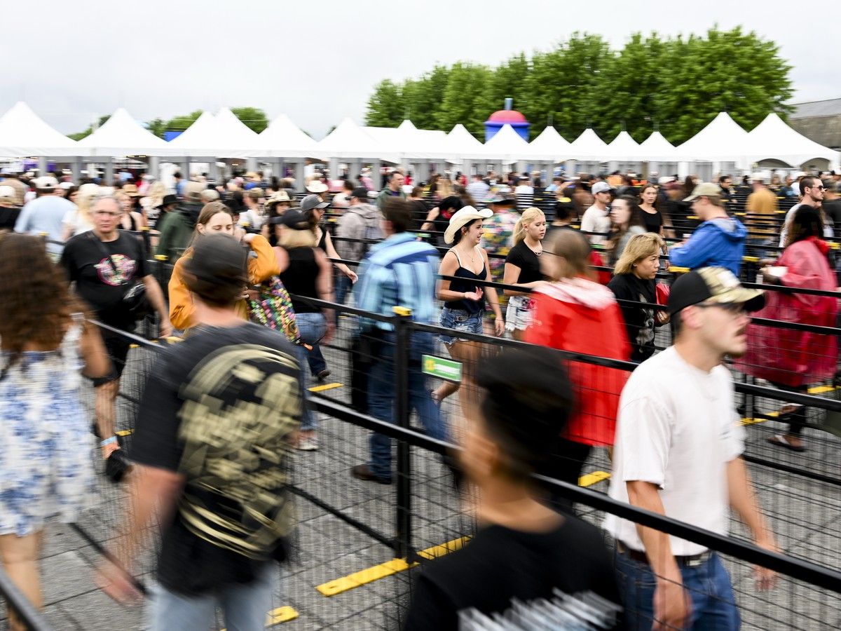 People make their way toward security during the opening night of Bluesfest at LeBreton Flats on July 9. People make their way toward security during the opening night of Bluesfest at LeBreton Flats on July 9.