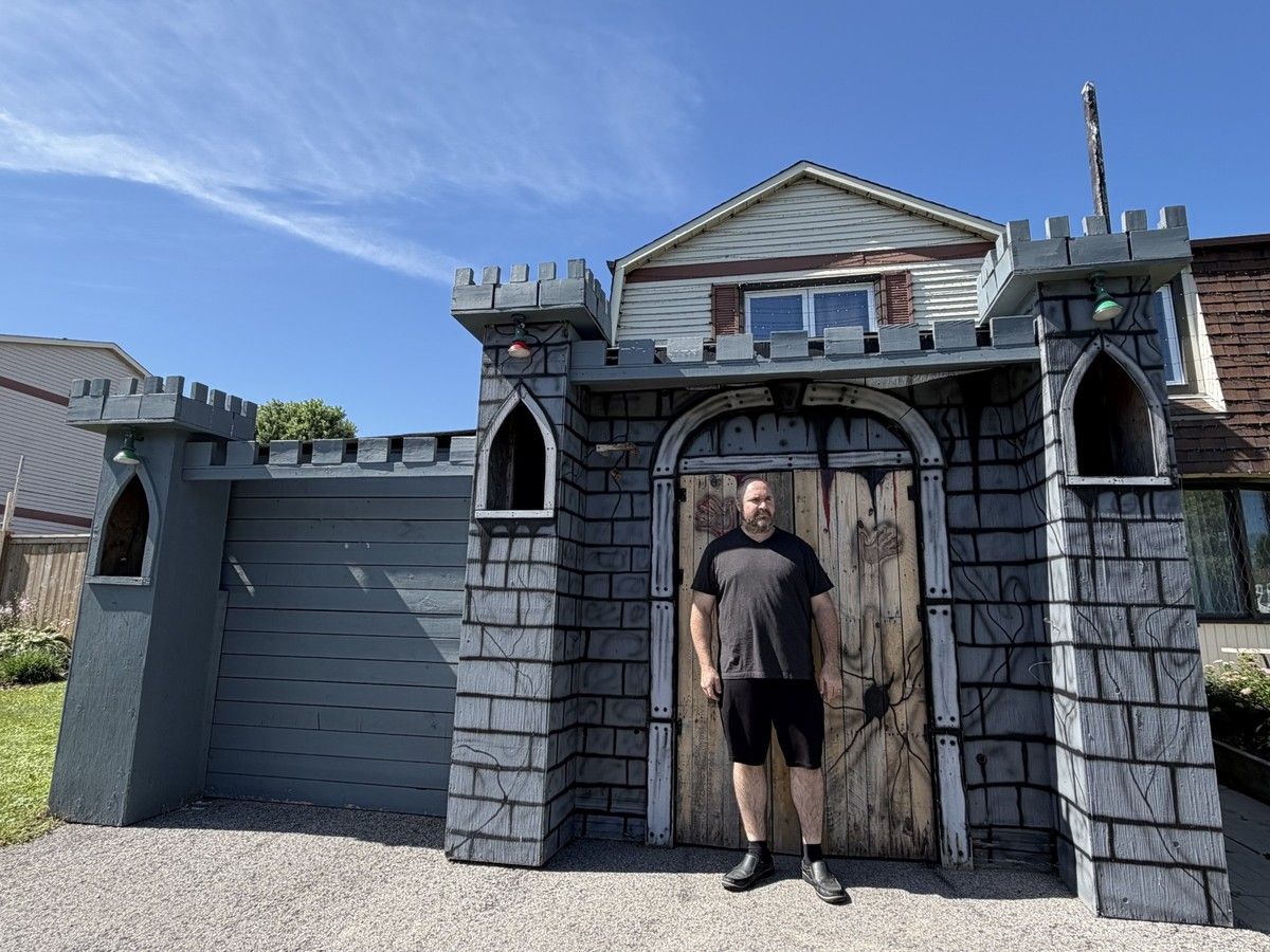 Patrick Albert stands in front of his parents’ Orléans home. The front castle-like structure doubles as a Halloween house that has been operating for the last 26 years. Patrick Albert stands in front of his parents’ Orléans home. The front castle-like structure doubles as a Halloween house that has been operating for the last 26 years.