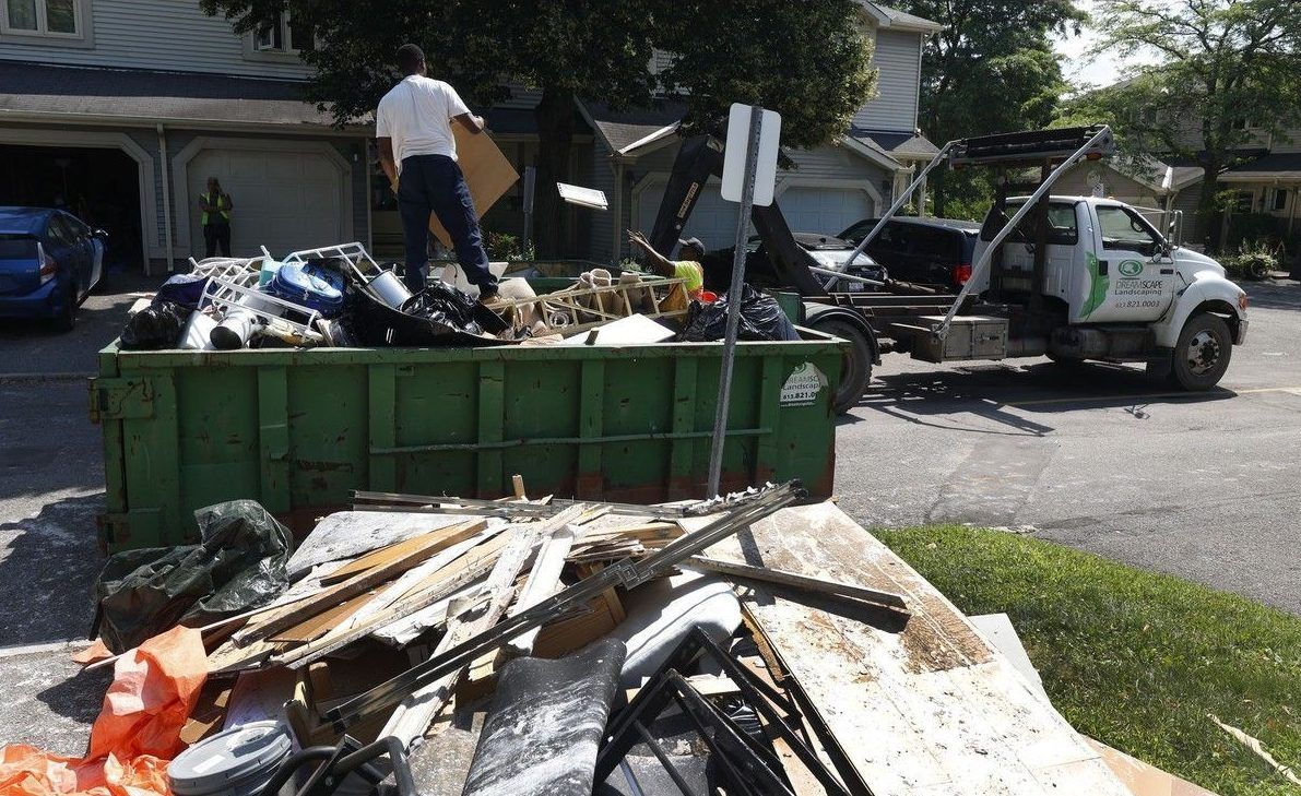 Crews help clean up damaged flooded items on Saxton Private. Crews help clean up damaged flooded items on Saxton Private.