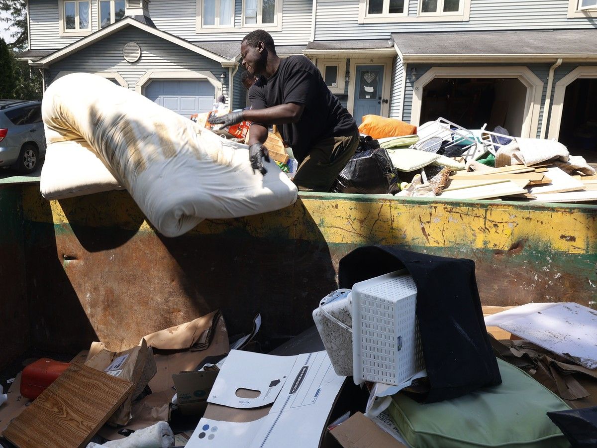 Crews help clean up damaged flooded items on Saxton Private. Crews help clean up damaged flooded items on Saxton Private.