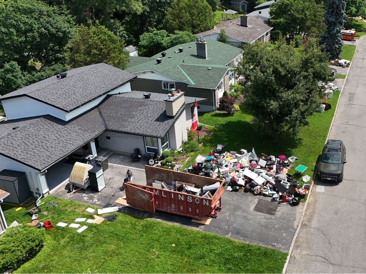 A huge pile of discarded items is seen outside the Bards’ home on July 7. A huge pile of discarded items is seen outside the Bards’ home on July 7.