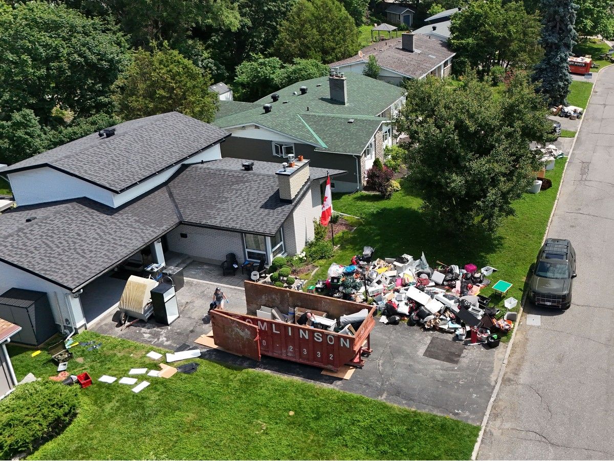 Andre and Jolene Bard start the process of cleaning out their flooded home on Queensline Drive in Ottawa Tuesday. A massive flood destroyed their basement with flooded sewage water July 1. The couple just moved into their house recently, moving from Australia to Ottawa. Andre and Jolene Bard start the process of cleaning out their flooded home on Queensline Drive in Ottawa Tuesday. A massive flood destroyed their basement with flooded sewage water July 1. The couple just moved into their house recently, moving from Australia to Ottawa.
