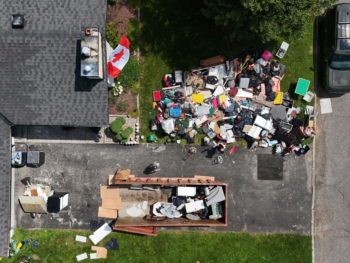 Andre and Jolene Bard start the process of cleaning out their flooded home on Queensline Drive in Ottawa Tuesday. A massive flood destroyed their basement with flooded sewage water July 1. The couple just moved into their house recently, moving from Australia to Ottawa. Andre and Jolene Bard start the process of cleaning out their flooded home on Queensline Drive in Ottawa Tuesday. A massive flood destroyed their basement with flooded sewage water July 1. The couple just moved into their house recently, moving from Australia to Ottawa.