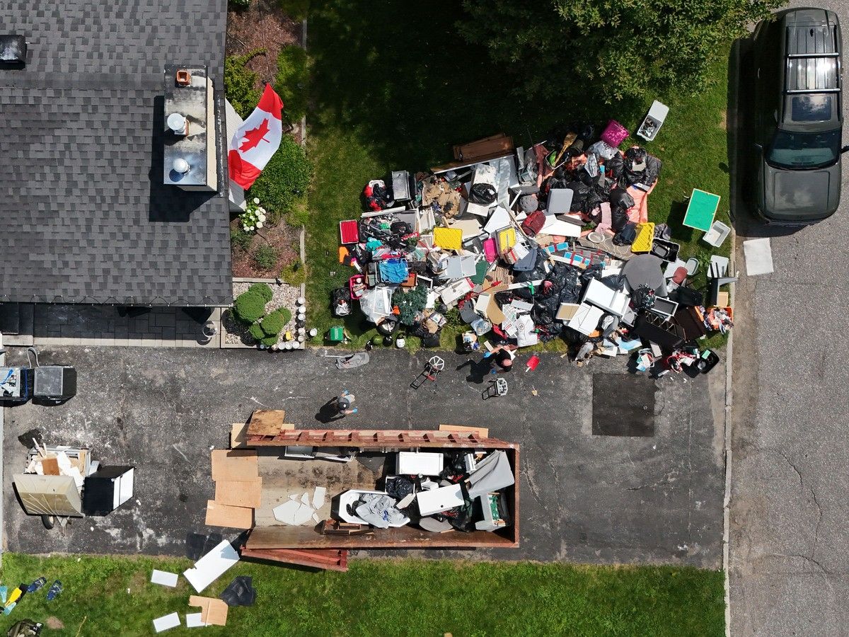 A July 7 file photo shows flood-damage items piled up outside a home on Queensline Drive in Ottawa, the result of flooding caused by the massive rainstorm on July 1. A July 7 file photo shows flood-damage items piled up outside a home on Queensline Drive in Ottawa, the result of flooding caused by the massive rainstorm on July 1.