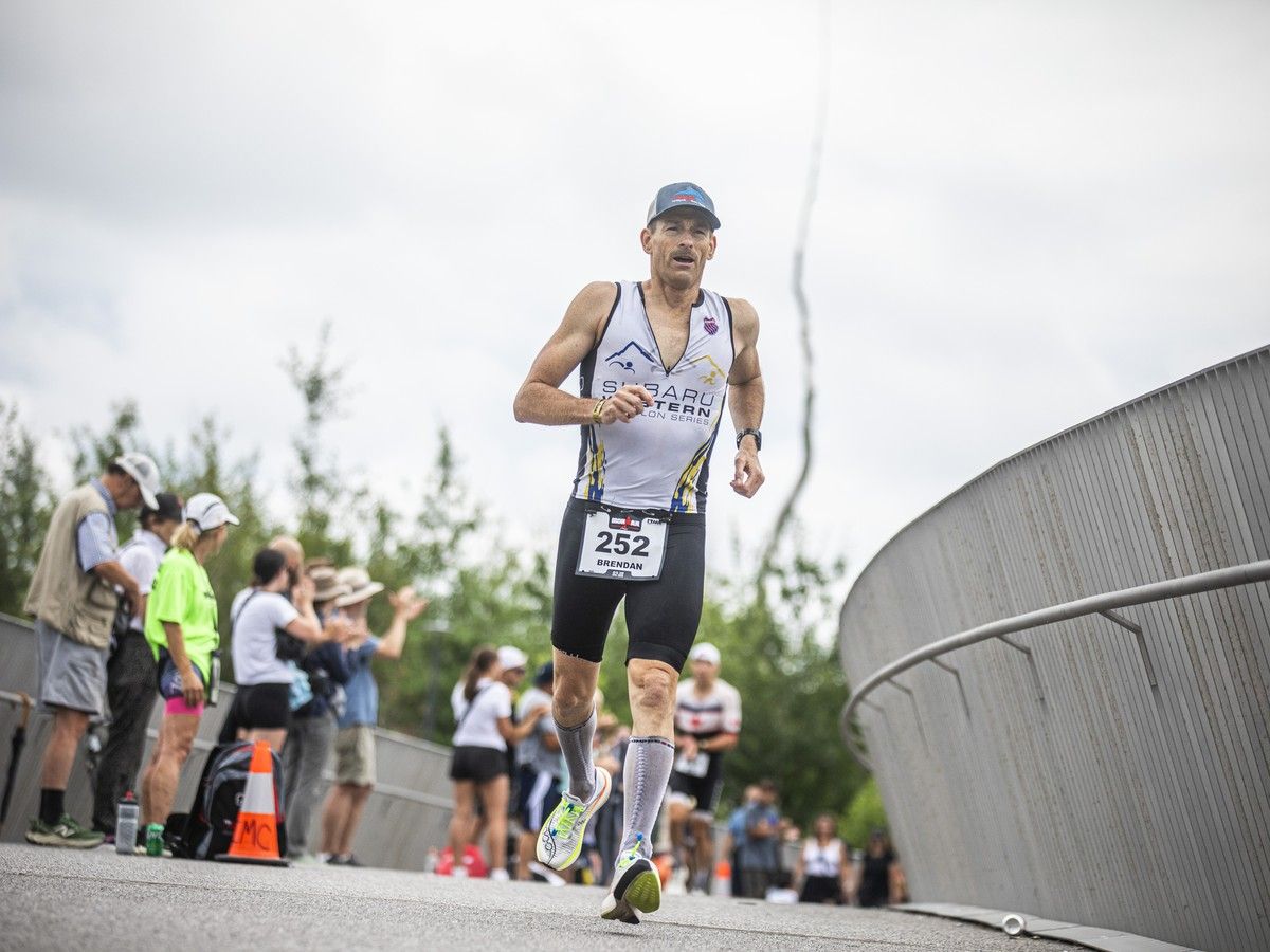 Brendan Naef climbs over Pìdàban Passage, the new bridge connecting Major’s Hill Park to the Kìwekì Point, during the IRONMAN race Sunday. Brendan Naef climbs over Pìdàban Passage, the new bridge connecting Major’s Hill Park to the Kìwekì Point, during the IRONMAN race Sunday.