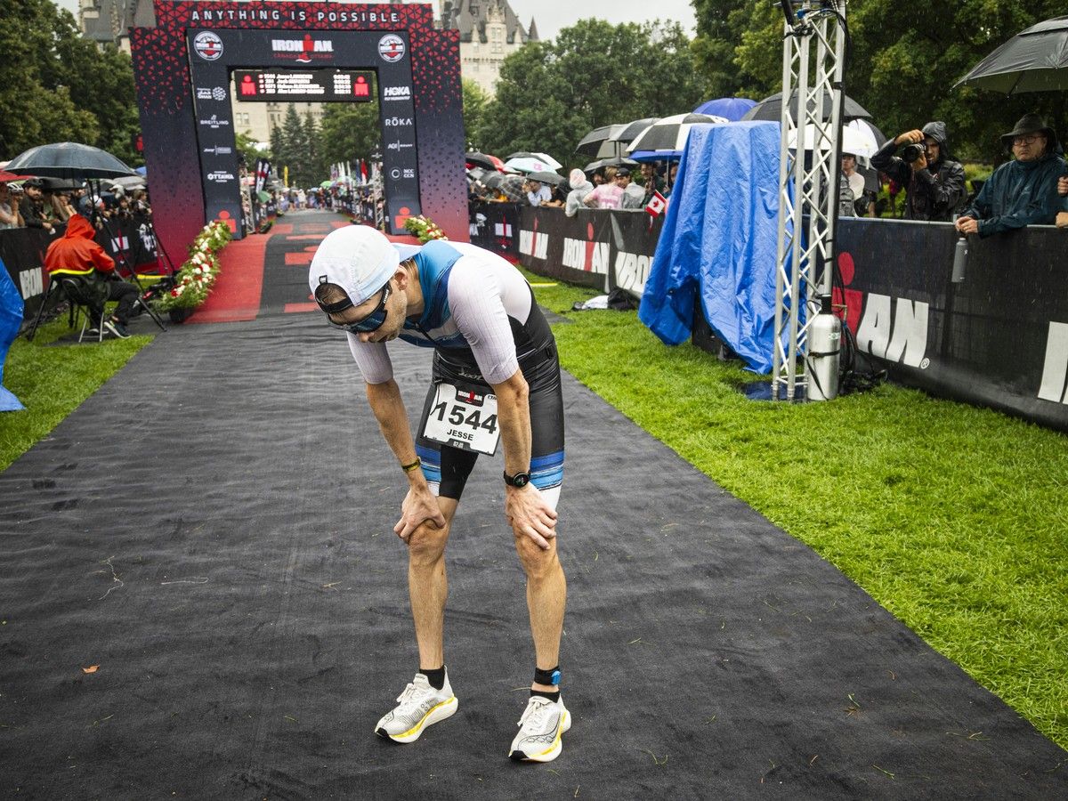 Jesse Langevin takes a moment after finishing the IRONMAN race Sunday. Jesse Langevin takes a moment after finishing the IRONMAN race Sunday.
