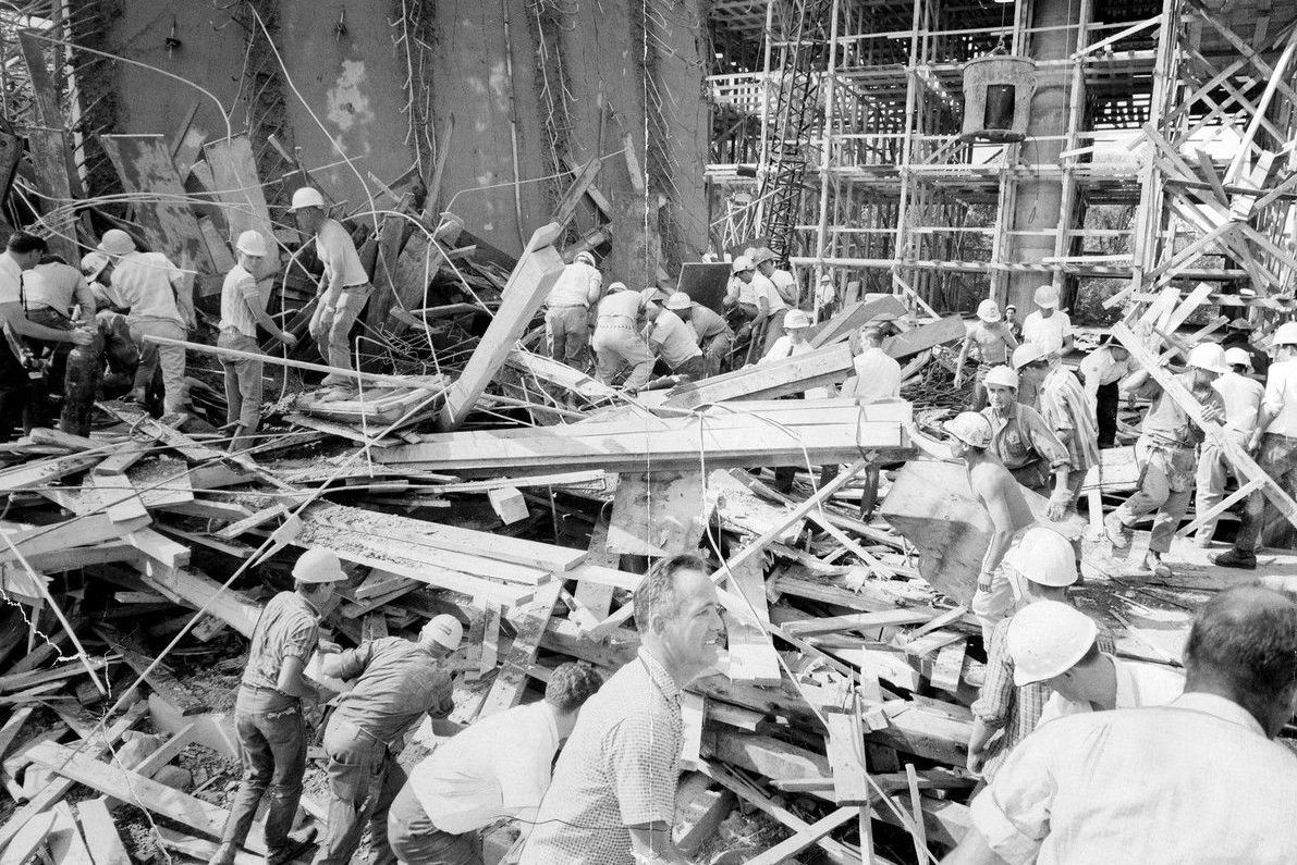 Workers at the Heron Road Bridge collapse search for men