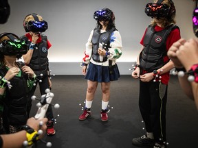 Ottawa Citizen reporter Abyssinia Abebe took part in a full-body virtual reality gaming experience at Sandbox VR in Ottawa's ByWard Market on Sunday, Aug. 9, 2026.