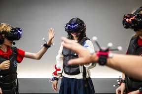 Ottawa Citizen reporter Abyssinia Abebe took part in a full-body virtual reality gaming experience at Sandbox VR in Ottawa's ByWard Market on Sunday, Aug. 9, 2026.