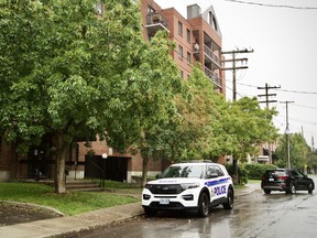 An Ottawa police vehicle sits outside 234 Guigues Ave. in Lowertown on a rainy Sunday, Aug. 23, 2026, as police investigate a suspicious death.