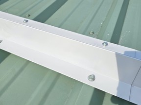 Ice guards need to be strong and anchored solidly to resist the downward pressures of ice and snow. This guard is made of a double thickness of metal and is fastened with over-sized roof screws.