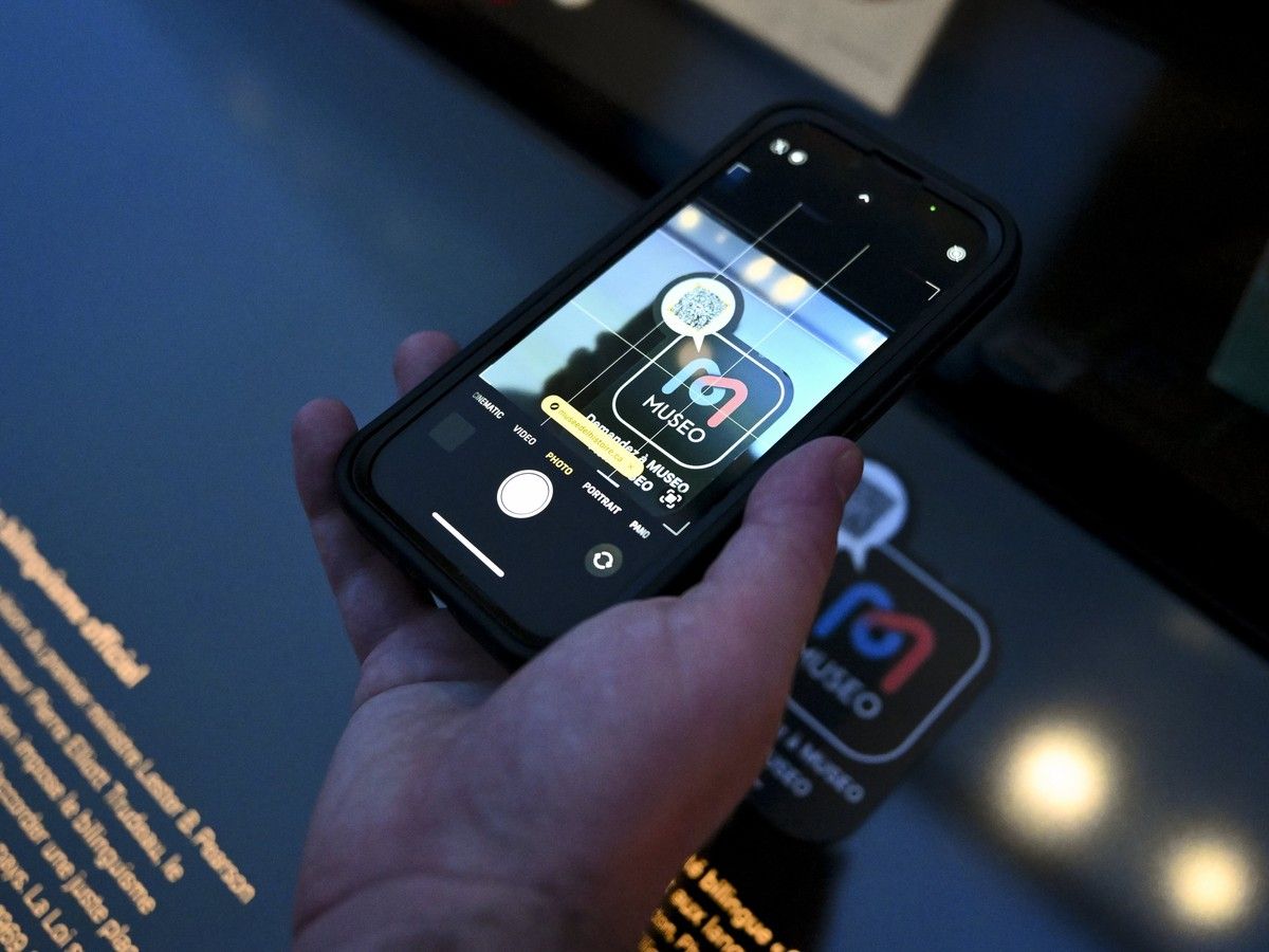 Reporter Michael McBean uses a phone to scan a MUSEO QR code at the Canadian Museum of History in Gatineau on Monday, Aug. 3, 2026. Reporter Michael McBean uses a phone to scan a MUSEO QR code at the Canadian Museum of History in Gatineau on Monday, Aug. 3, 2026.