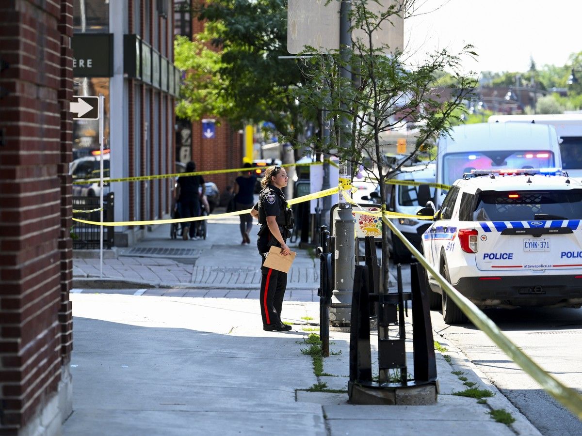 An officer from the Ottawa Police Service (OPS) stands at the scene of a stabbing in Centretown on Tuesday, Aug. 4, 2026. An officer from the Ottawa Police Service (OPS) stands at the scene of a stabbing in Centretown on Tuesday, Aug. 4, 2026.
