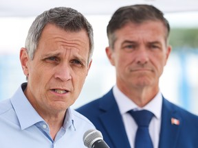 Sutcliffe and Tim Tierney at a presser.
