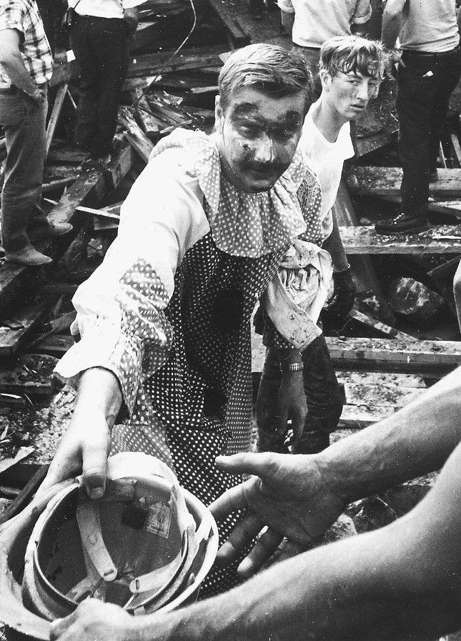 A clown who had been at the scene pitches in to help.