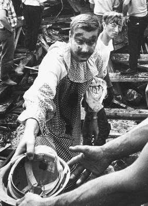 A clown who had been at the scene pitches in to help.