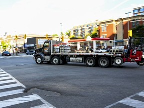 A truck passes through the intersection of King Edward Avenue and Rideau Street in downtown Ottawa on Tuesday, Aug. 18, 2026.